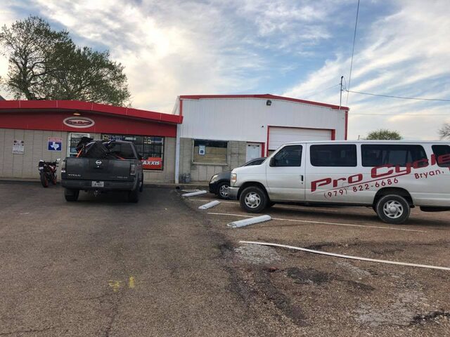 The Pro Cycle storefront and shop van on S Coulter Drive in Bryan